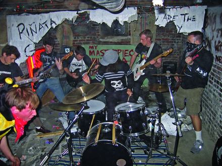 The band bursting through the piñata wall